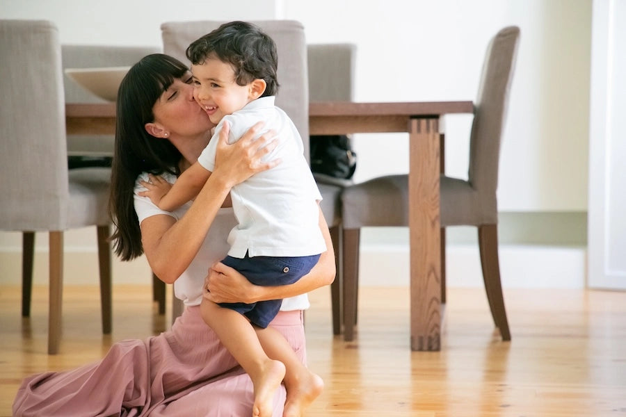 Children’s naturopathy support showing parent holding and comforting child in a calm home environment